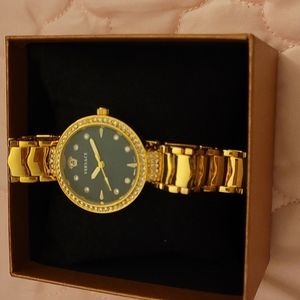 Versace watch, small size and gold with crystal around.